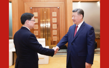习近平会见李家超